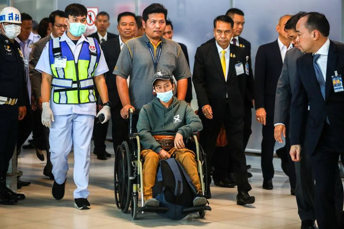 Somma, a migrant agricultural worker who was injured by a surprise attack on Israel by the Palestinian militant group Hamas, arrives at Bangkok's Suvarnabhumi Airport, Thailand, October 12, 2023. REUTERS/Chalinee Thirasupa