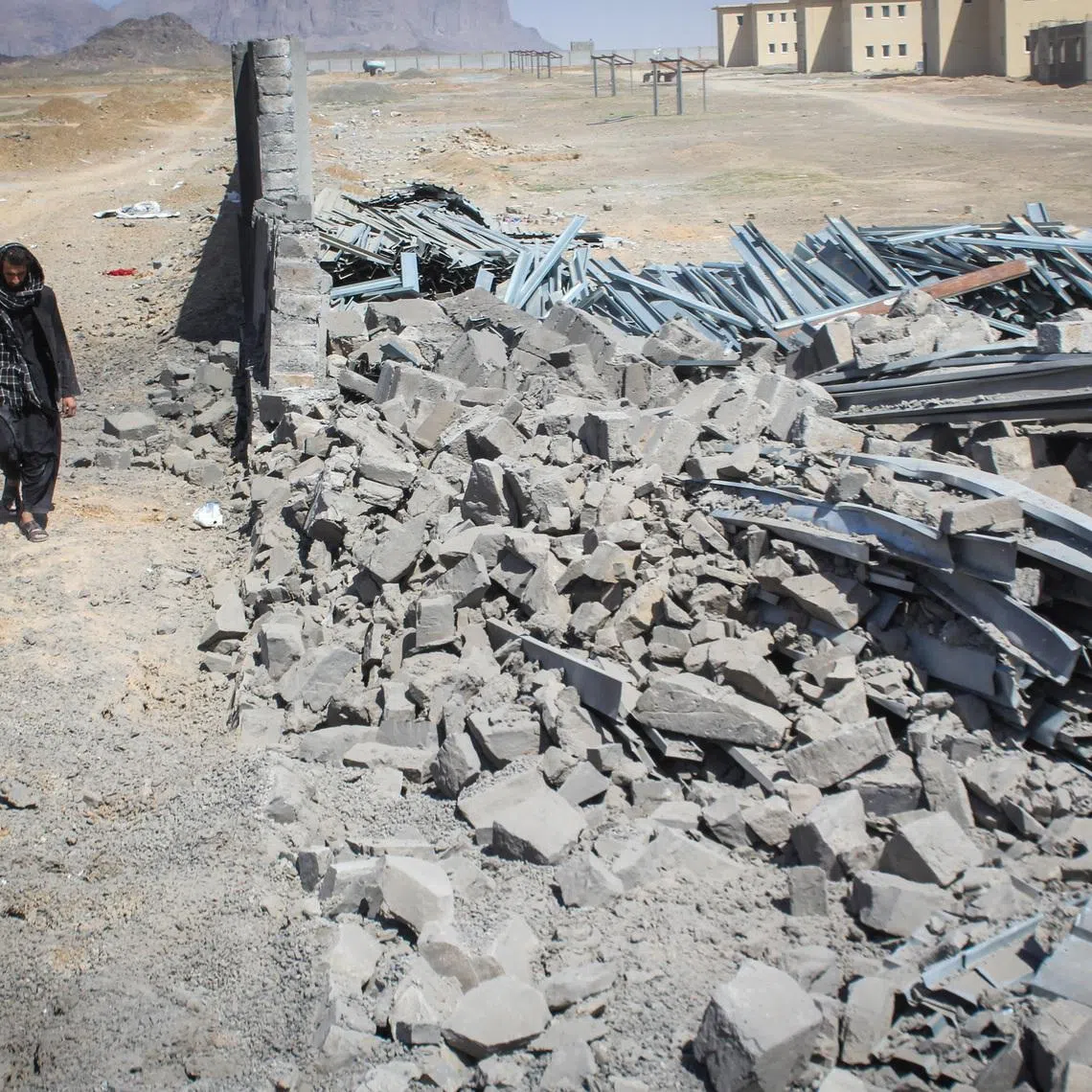 An Afghan man walks past a damaged wall following airstrikes, amid the conflict between Afghanistan and Pakistan, in Kandahar, Afghanistan, February 28, 2026. REUTERS/Stringer
