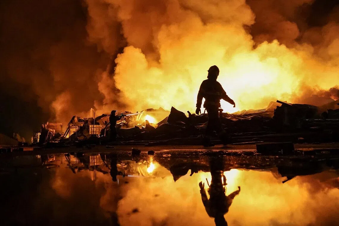 Firefighters work at a site of a Russian missile strike, amid Russia's attack on Ukraine, in Kyiv region, Ukraine, August 5, 2026. REUTERS/Anatolii Stepanov TPX IMAGES OF THE DAY
