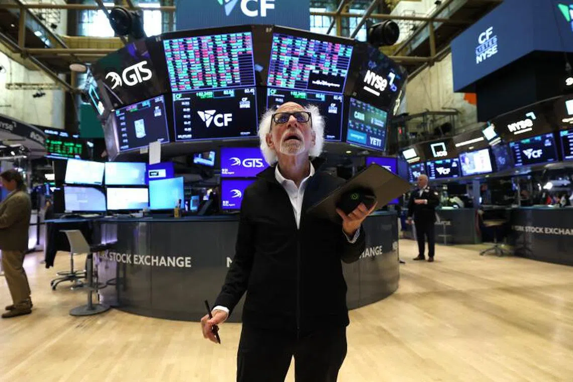 Stock trader Peter Tuchman "Einstein of Wall Street" works on the floor of the New York Stock Exchange (NYSE) at the opening bell in New York City, on August 11, 2025. Wall Street stocks opened mixed Monday, ahead of a key US inflation report and as the clock ticked down to a deadline for higher tit-for-tat tariffs to return between Washington and Beijing. (Photo by TIMOTHY A. CLARY / AFP)