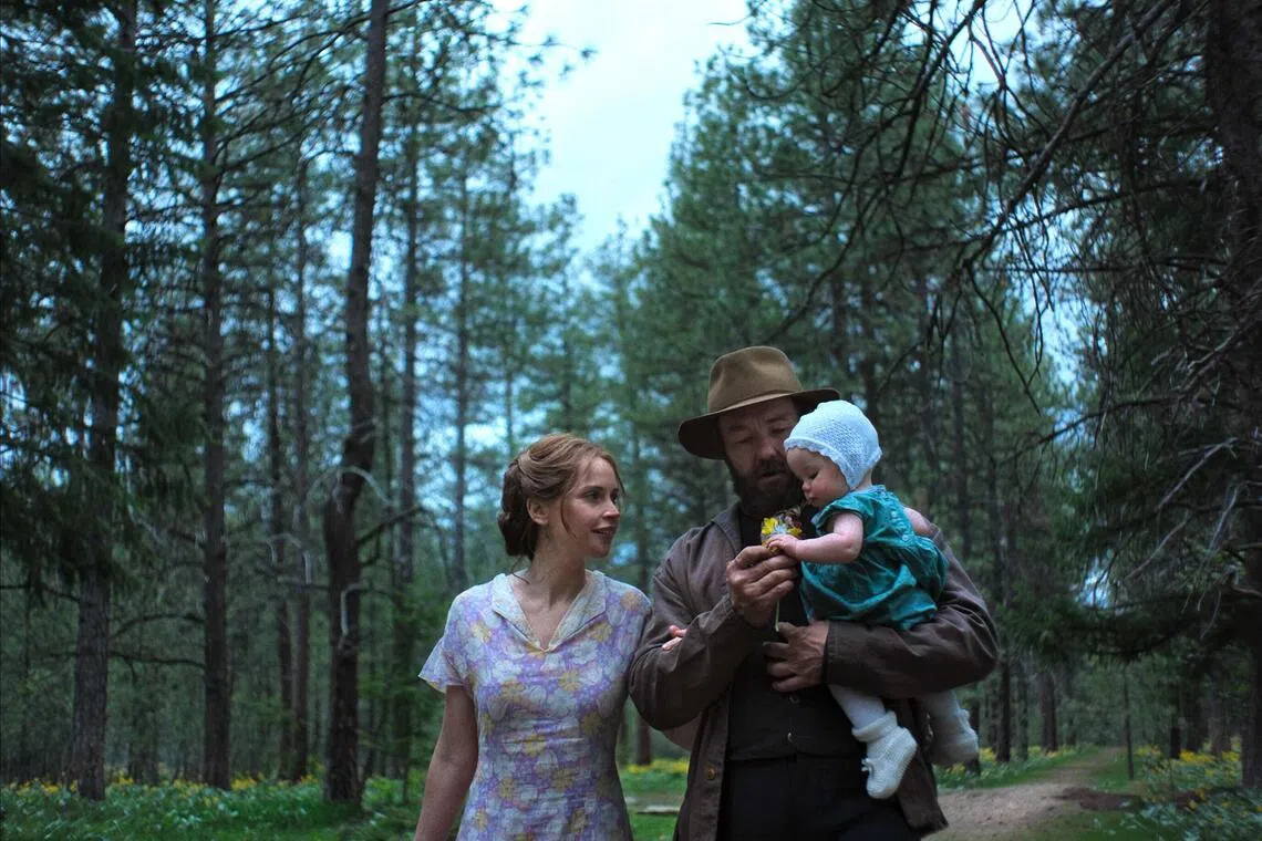 Felicity Jones (left) as Gladys and Joel Edgerton (centre) as Robert Grainier in Train Dreams.
