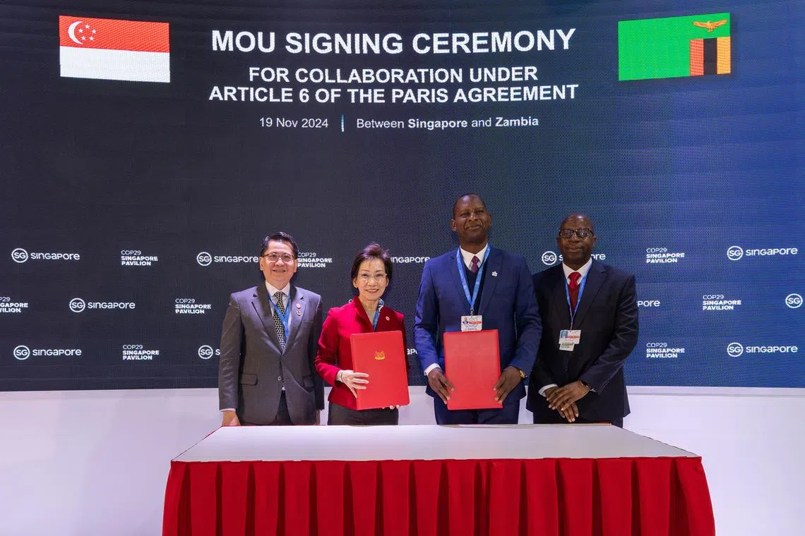 Permanent Secretary for Sustainability and Environment Stanley Loh, Minister for Sustainability and the Environment Grace Fu, Zambia’s Minister for Green Economy and Environment Mike Mposha and Permanent Secretary for Zambia's Ministry of Green Economy and Environment Douty Chibamba.