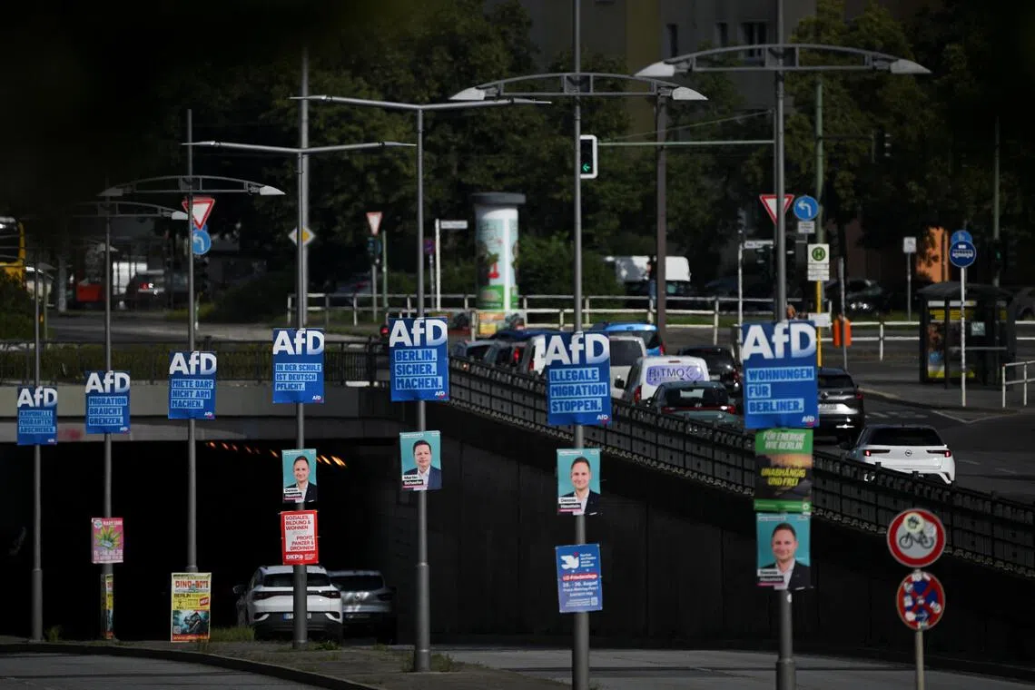 Cars drive past election campaign posters of the Alternative for Germany party (AfD) for the upcoming Berlin state election, in Berlin, on Aug 3.