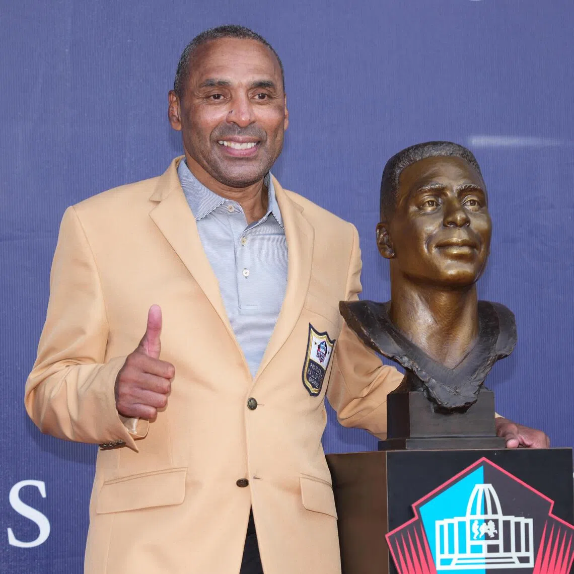 NFL Hall of Fame enshrinee Roger Craig posing on stage on Aug 8, during the Class of 2026 enshrinement ceremony at the Tom Benson Hall of Fame Stadium.