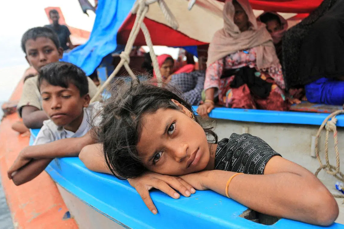 FILE PHOTO: A Rohingya refugee child looks on as she is stranded due to a boat engine failure in the waters of South Aceh, Aceh province, Indonesia, October 20, 2024, in this photo taken by Antara Foto. Antara Foto/Syifa Yulinnas/via REUTERS