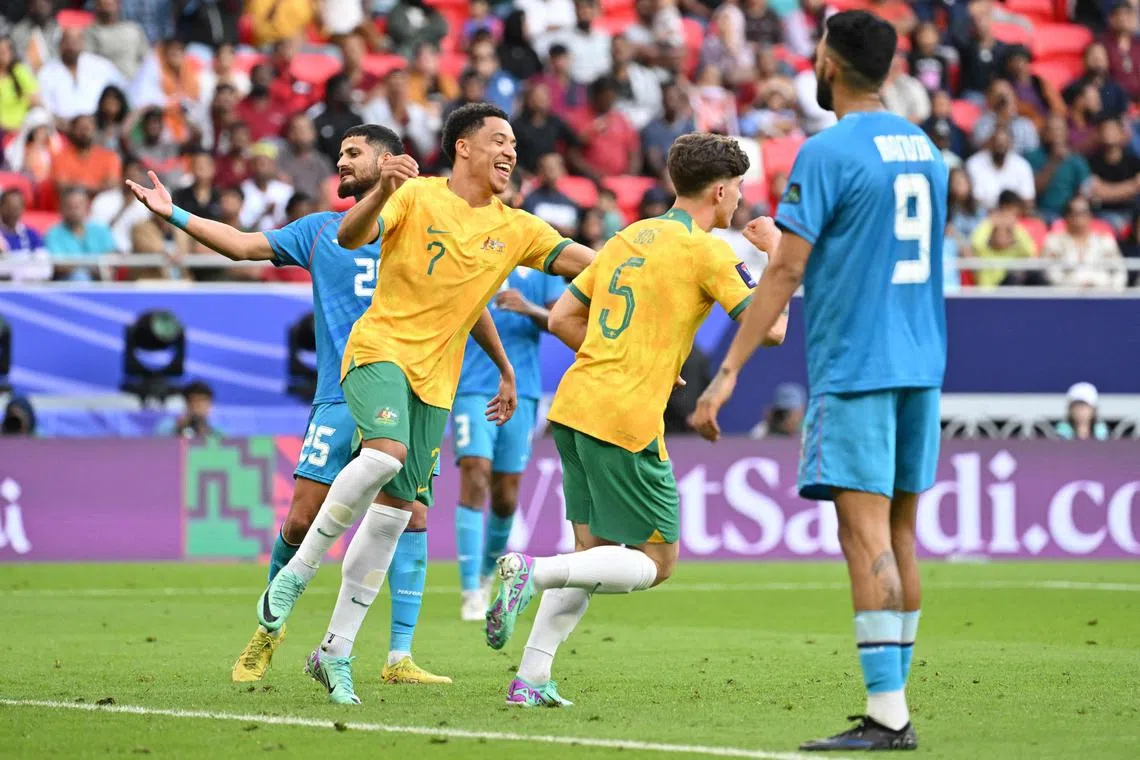 Australia defender Jordan Bos celebrates after scoring his team's second goal in the 2-0 Asian Cup win over India.