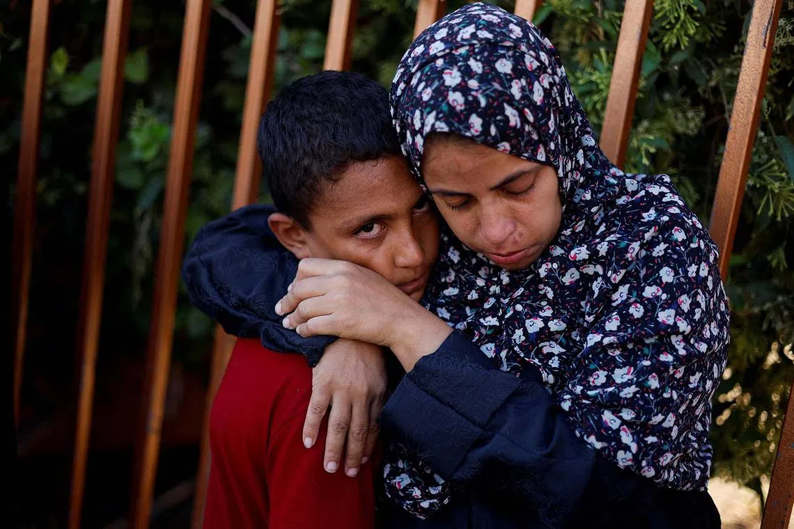 Mourners at the funeral of Palestinians killed in Israeli strikes, amid the Israel-Hamas conflict, at Nasser hospital, in Khan Younis, southern Gaza Strip, Aug 26, 2024. 
