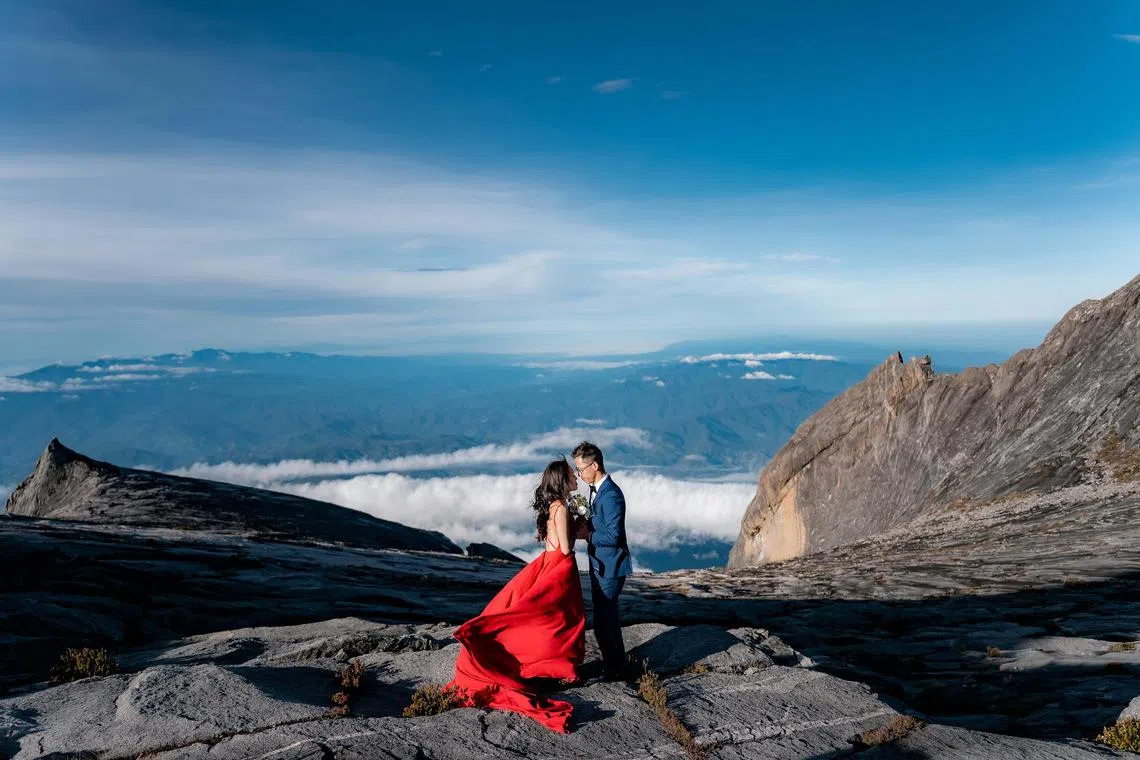 Mr Low Chee Seng (right) and Ms Lilian Wang took their pre-wedding pictures on Mount Kinabalu. 

