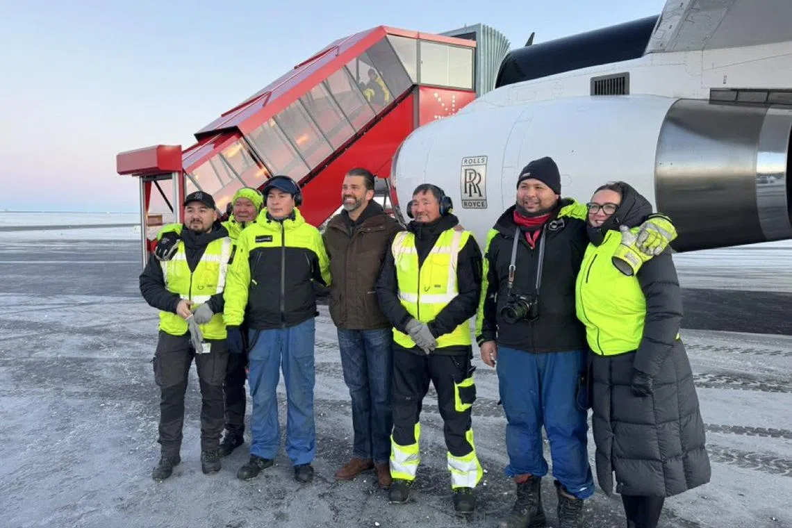 Donald Trump Jr (fourth from left) - the son of US President-elect Donald Trump - arriving in Greenland on Jan 7, on what he called a private day trip.