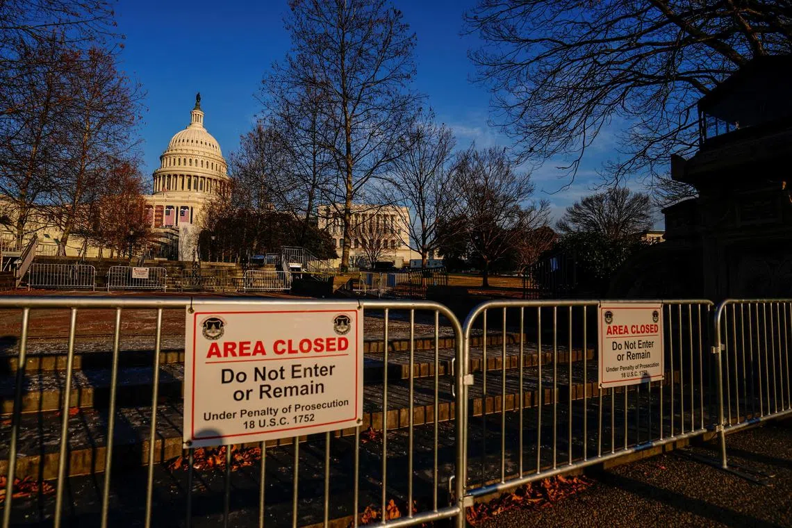 The U.S. Capitol is seen while police signs remain in place to keep the public off the property as workers take down inaugural stands in Washington, U.S. January 26, 2025.  REUTERS/Ken Cedeno