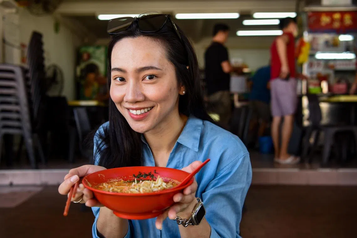 ST20230724_202355735827-Eugene Tan-Jan Lee-jaali05/

Alison Wu a Taiwanese Food Blogger who resides in Singapore with a bowl of  Laksa from Katong Laksa on July 24, 2023./

(ST PHOTO: EUGENE TAN)