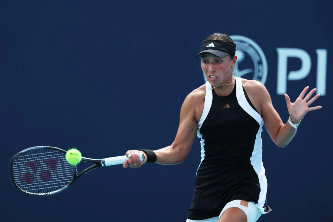 Jessica Pegula returns a shot against Lin Zhu of China during their match on day 8 of the Miami Open.