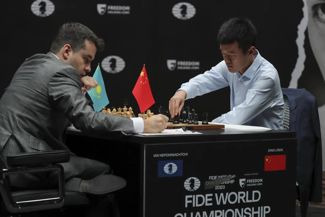 Grandmasters Ian Nepomniachtchi from Russia and China's Ding Liren facing off at the chess world championship in Astana, Kazakhstan. The Russian leads 4-3 at the halfway mark.