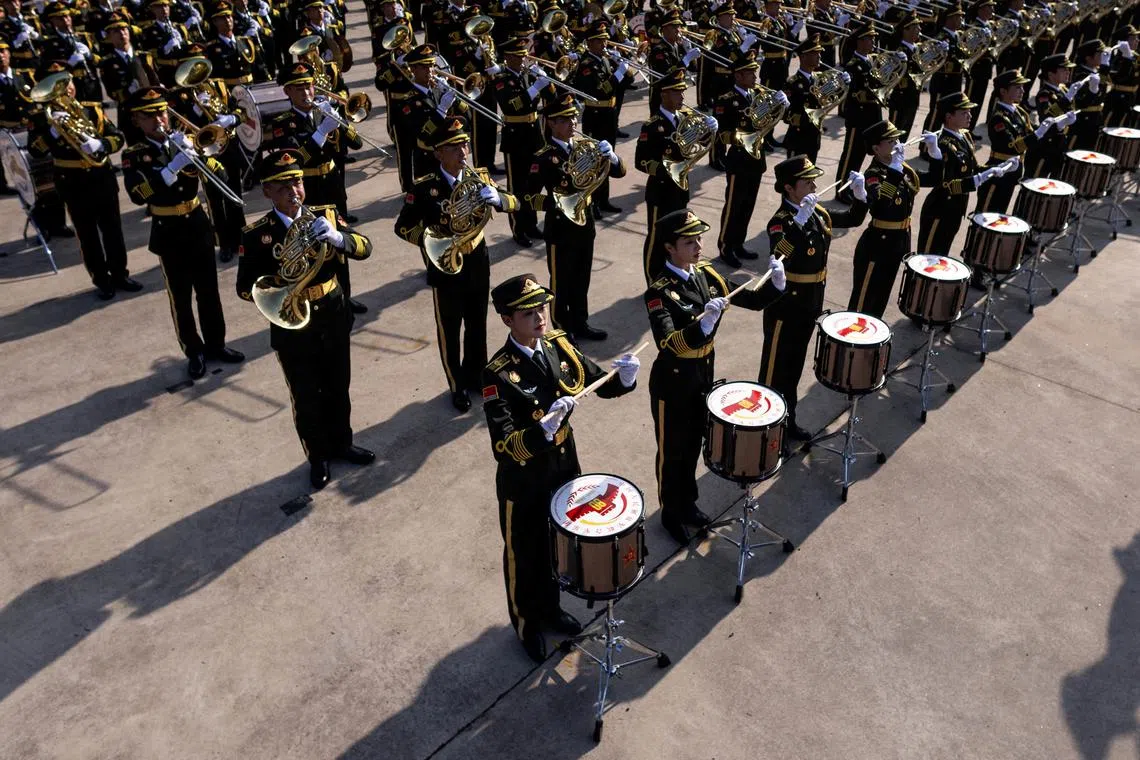 FILE PHOTO: A military orchestra plays during training ahead of a military parade to mark the 80th anniversary of the end of World War Two, in Beijing, China, August 20, 2025. REUTERS/Maxim Shemetov/File Photo