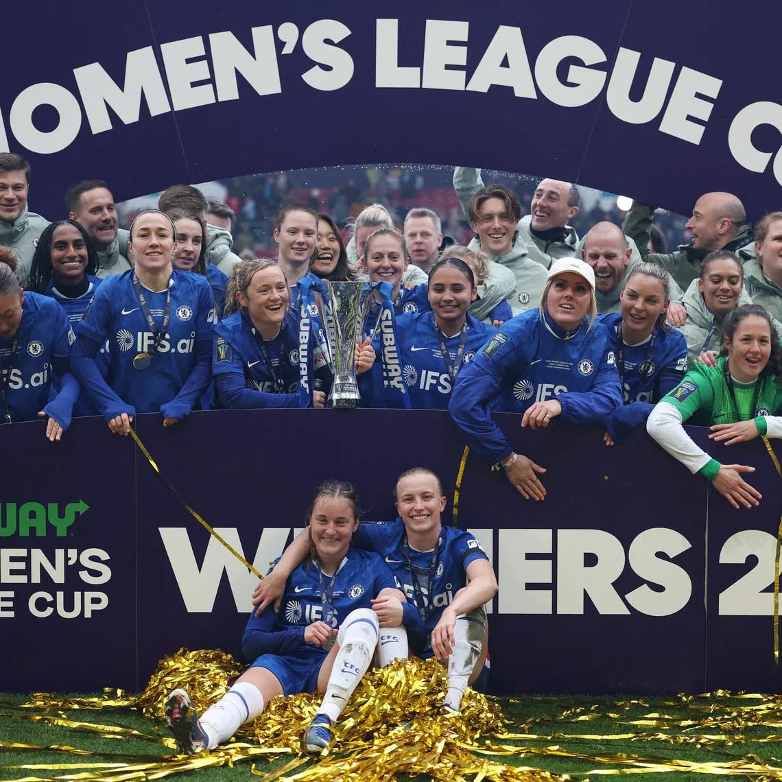 Soccer Football - Women's League Cup - Final - Chelsea v Manchester United - Ashton Gate Stadium, Bristol, Britain - March 15, 2026 Chelsea's Erin Cuthbert holds the trophy with teammates after winning the Women's League Cup final Action Images via Reuters/John Sibley