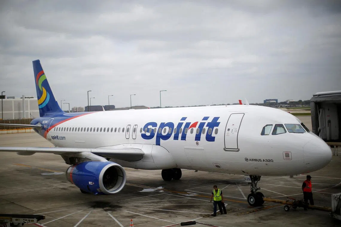 FILE PHOTO: A Spirit Airlines Airbus A320-200 airplane sits at a gate at the O'Hare Airport in Chicago, Illinois October 2, 2014.  REUTERS/Jim Young/File Photo