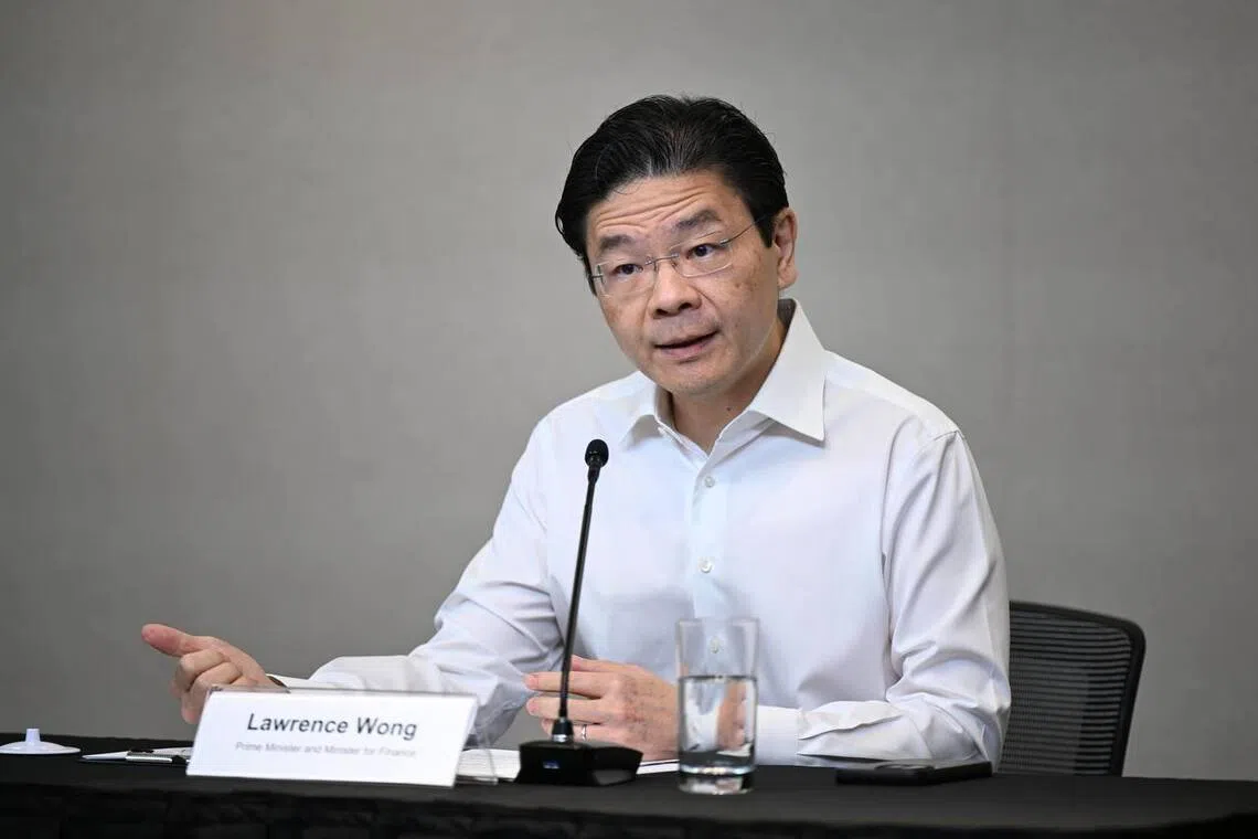 Prime Minister Lawrence Wong speaking at a press conference on April 26.