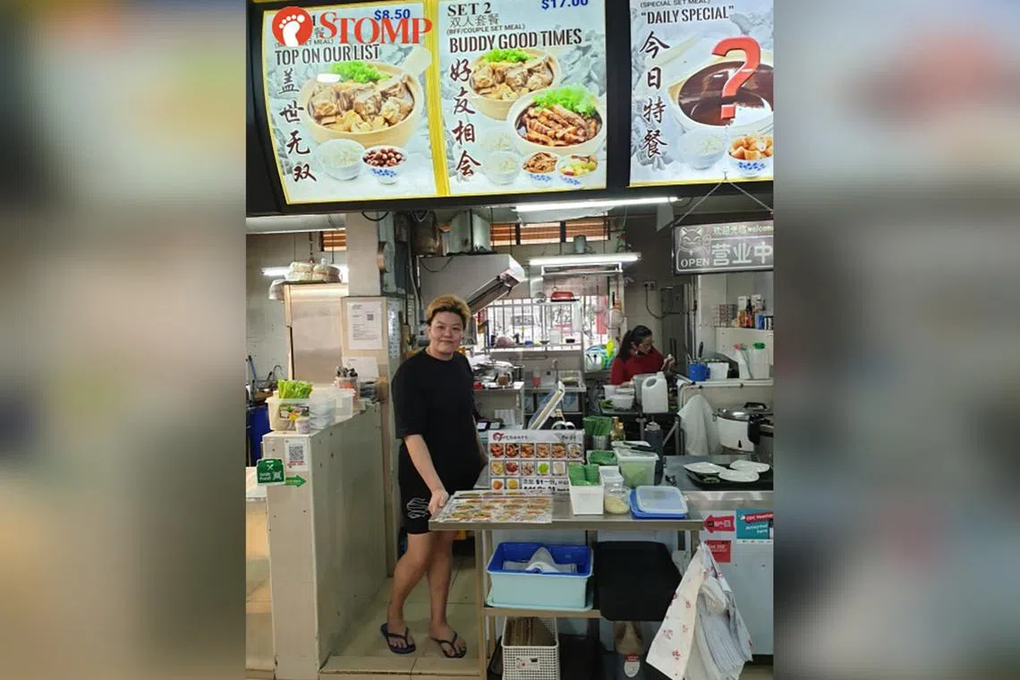 Ms Jalynn Woon was surprised to find a stack of $100 notes inside an unattended bag in front of her bak kut teh stall in Jurong West.