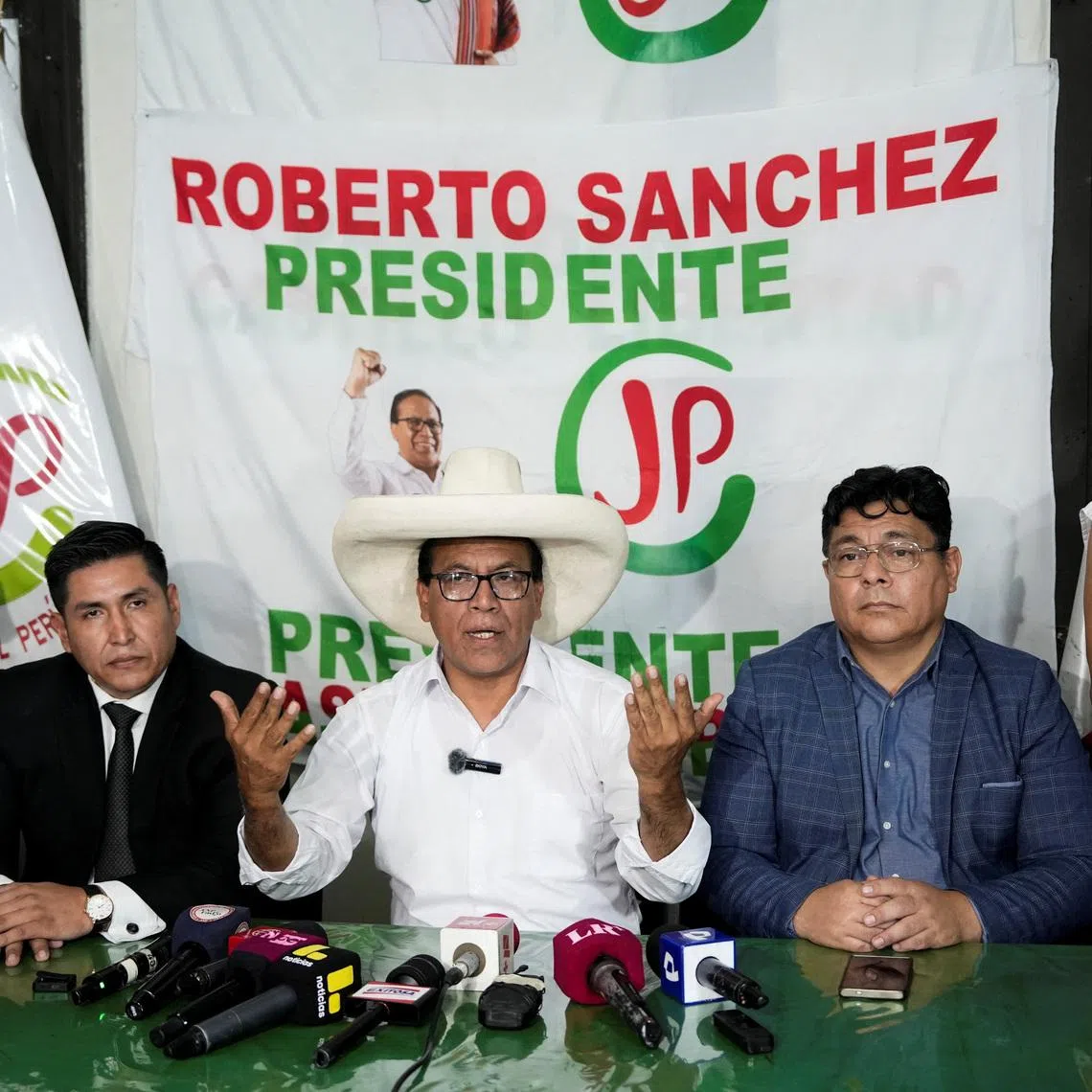 Roberto Sanchez, presidential candidate of the Together for Peru party, speaks with members of the media as he waits for the election results after Peru's general election was extended to a second day in some precincts of the capital, in Lima, Peru, April 14, 2026. REUTERS/Angela Ponce