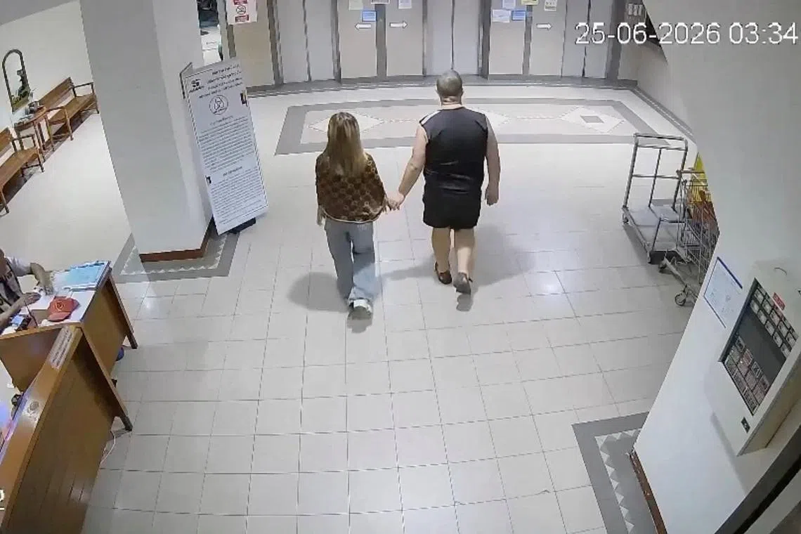 Simon Peter Carman with a 17-year-old Thai girl, whose body was later found in a suitcase, at a condominium in Pattaya, Thailand, on June 25.