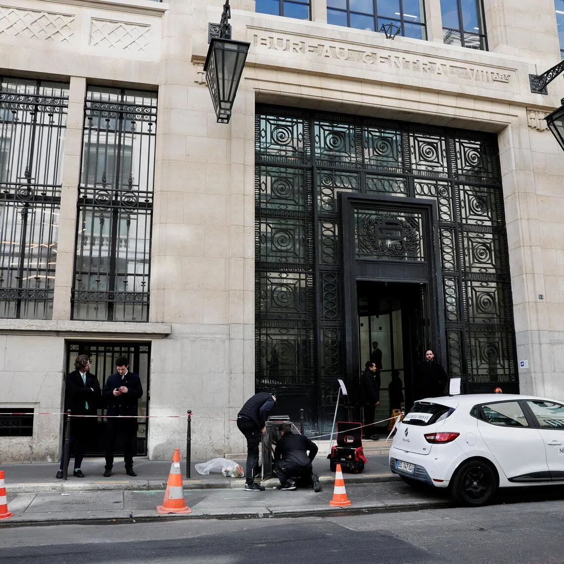 Private security members gather outside Bank of America’s Paris offices, after French anti-terrorism prosecutors opened an investigation into attempted destruction by fire or other dangerous means in Paris, France, on March 30, 2026.