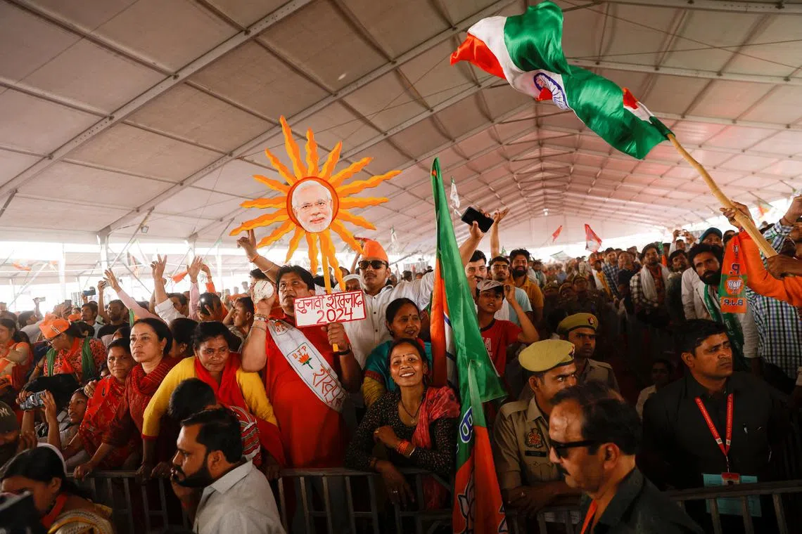 FILE PHOTO: Supporters of India's Prime Minister Narendra Modi attend an election campaign rally in Meerut, India, March 31, 2024. REUTERS/Anushree Fadnavis/File Photo