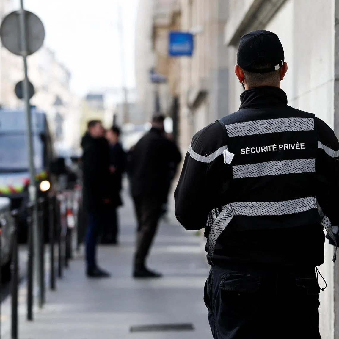 A private security member stands outside Bank of America’s Paris offices, after French anti-terrorism prosecutors opened an investigation into attempted destruction by fire or other dangerous means in Paris, France, March 30, 2026. REUTERS/Benoit Tessier