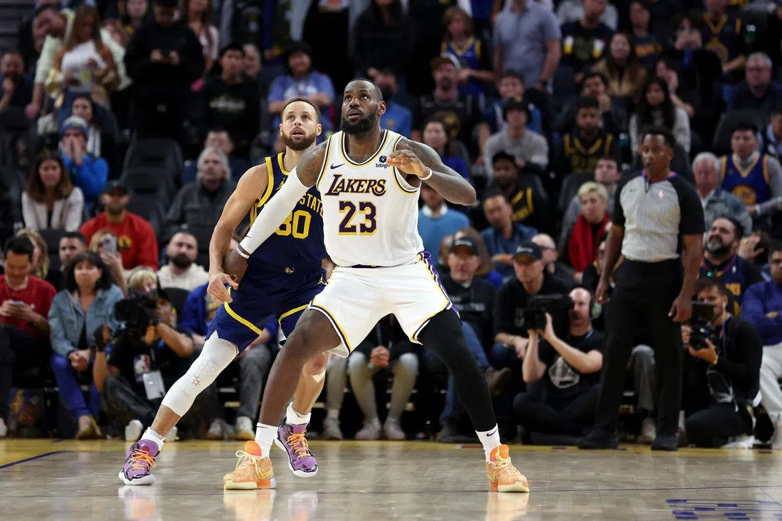 Stephen Curry of the Golden State Warriors matching up against LeBron James of the Los Angeles Lakers in overtime at Chase Center on Jan 27. James had 36 points with 20 rebounds and 12 assists, while Curry tallied 46 points with seven assists in the Lakers' 145-144 win.