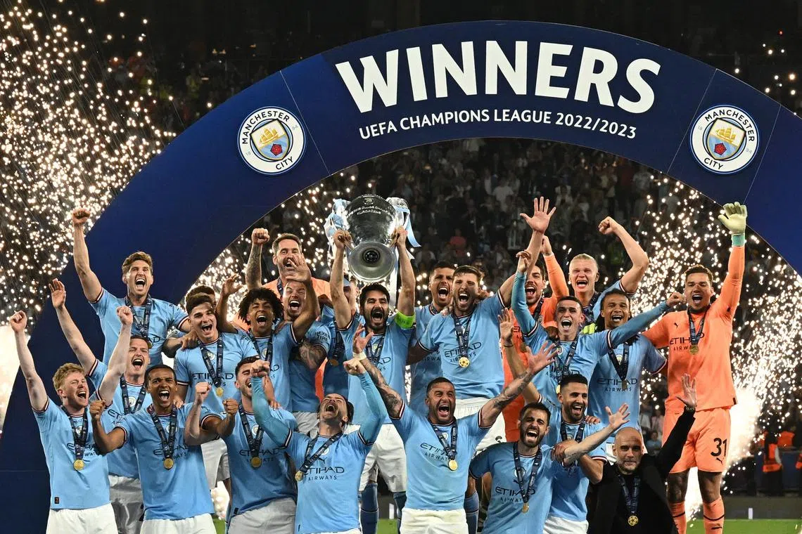 Manchester City's Ilkay Gundogan holds aloft the European Cup as they celebrate winning the Champions League final against Inter Milan at the Ataturk Olympic Stadium in Istanbul on Saturday. 