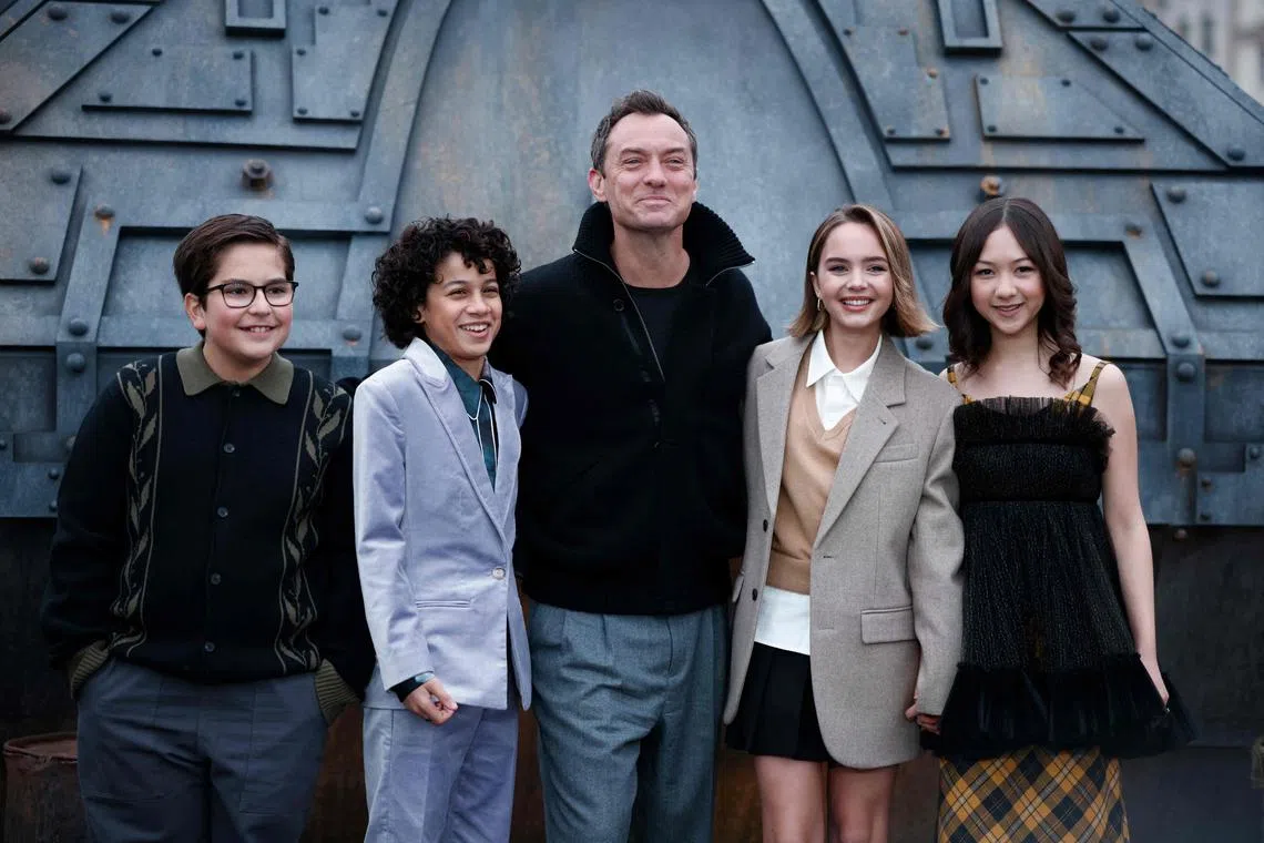 British actor Jude Law (centre) with co-stars (from left) Robert Timothy Smith, Ravi Cabot-Conyers, Ryan Kiera Armstrong and  Kyriana Kratter, during a Star Wars: Skeleton Crew photo call in London.