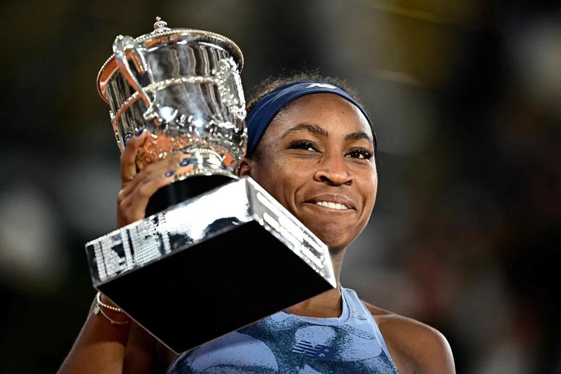 Coco Gauff of the US holds the French Open trophy, after winning against world No. 1 Aryna Sabalenka of Belarus.