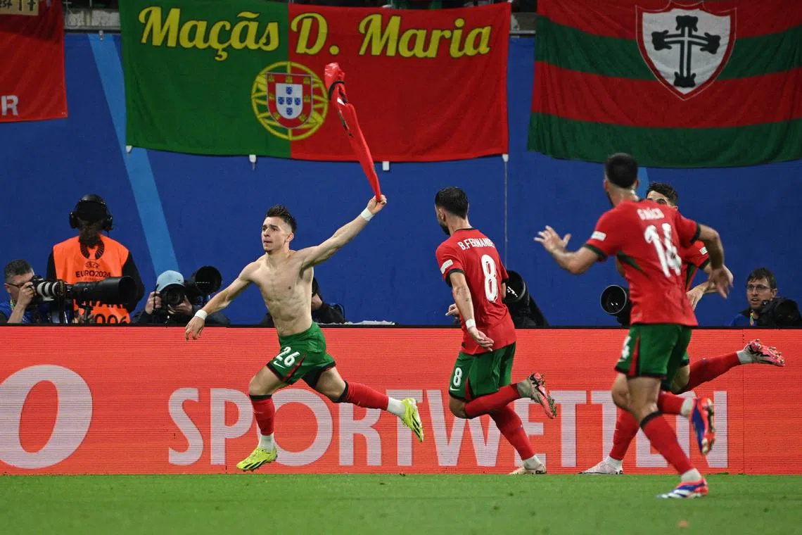 Soccer Football - Euro 2024 - Group F - Portugal v Czech Republic - Leipzig Stadium, Leipzig, Germany - June 18, 2024  Portugal's Francisco Conceicao celebrates scoring their second goal with Bruno Fernandes REUTERS/Annegret Hilse