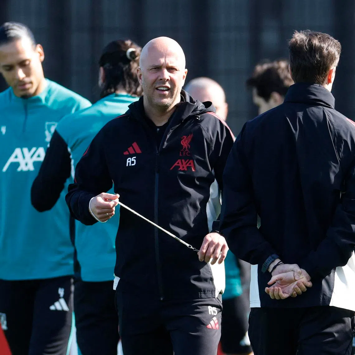 Soccer Football - UEFA Champions League - Liverpool Training - AXA Training Centre, Liverpool, Britain - March 17, 2026 Liverpool manager Arne Slot with players during training Action Images via Reuters/Jason Cairnduff