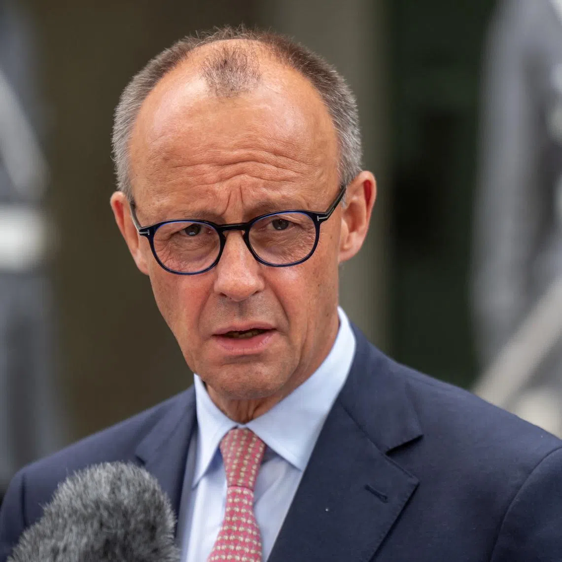 FILE PHOTO: German Chancellor Friedrich Merz gives a statement following his visit to the Operational Command of the German armed forces Bundeswehr in Schwielowsee near Berlin, Germany, June 28, 2025. Michael Kappeler/Pool via REUTERS/File Photo