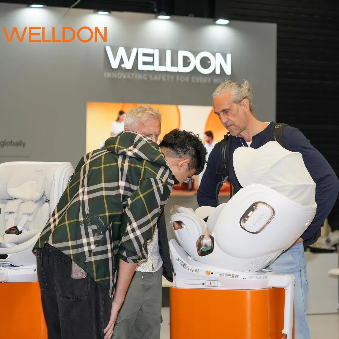 Baby car seats made by Chinese company Welldon draw visitors at a trade fair in Cologne, Germany, in Sept 2026.