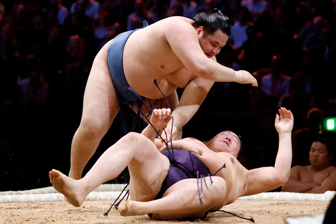 Onokatsu in action against Ichiyamamoto during the Grand Sumo Tournament held at the Royal Albert Hall, London, Britain, on Oct 15, 2025.