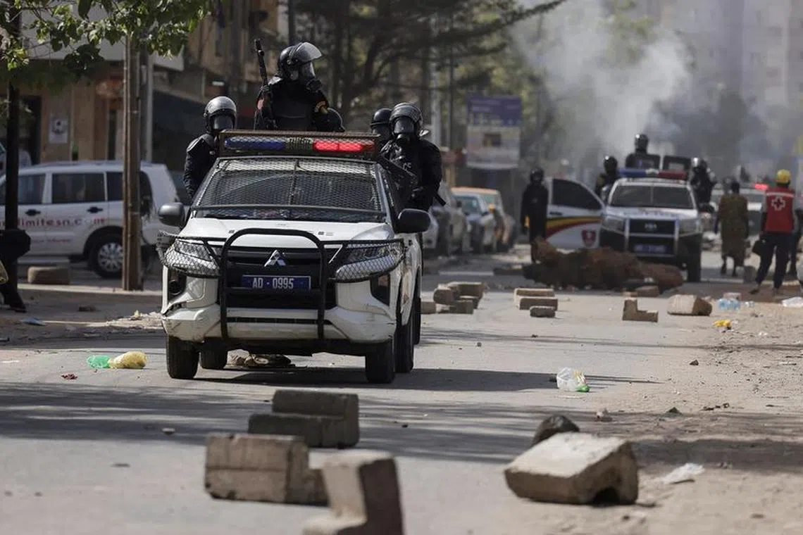 FILE PHOTO: Riot police members sit on a pick up during a protest against the postponement of the Feb. 25 presidential election, in Dakar, Senegal February 9, 2024. REUTERS/Zohra Bensemra/File Photo
