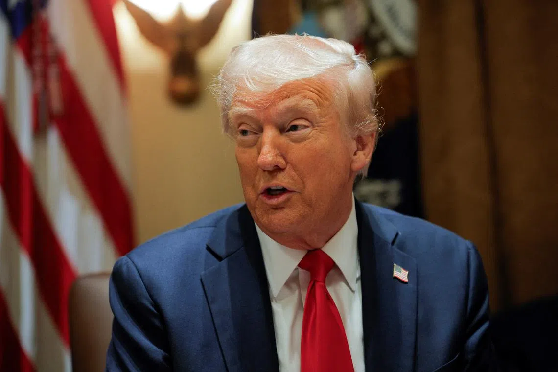 U.S. President Donald Trump hosts his first cabinet meeting with Elon Musk in attendance, Washington, D.C.,  U.S., February 26, 2025. REUTERS/Brian Snyder