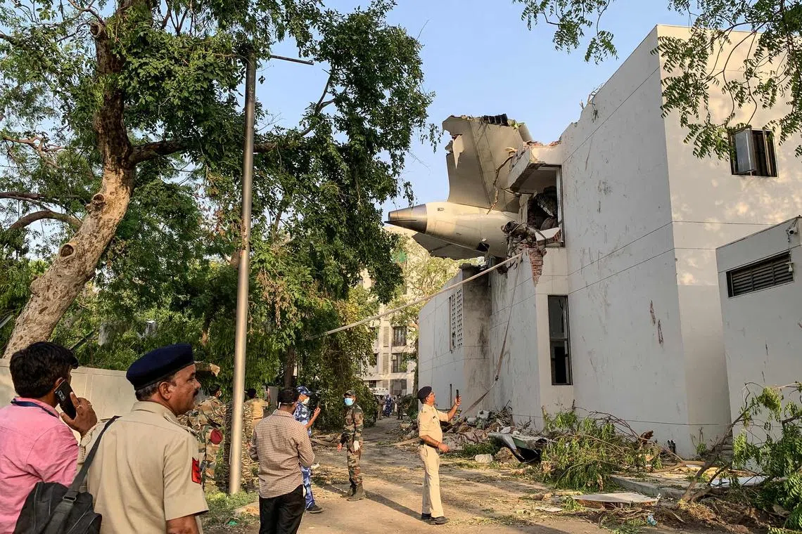 The back of Air India flight 171 is pictured at the site after it crashed in a residential area near the airport in Ahmedabad, on June 12, 2025.