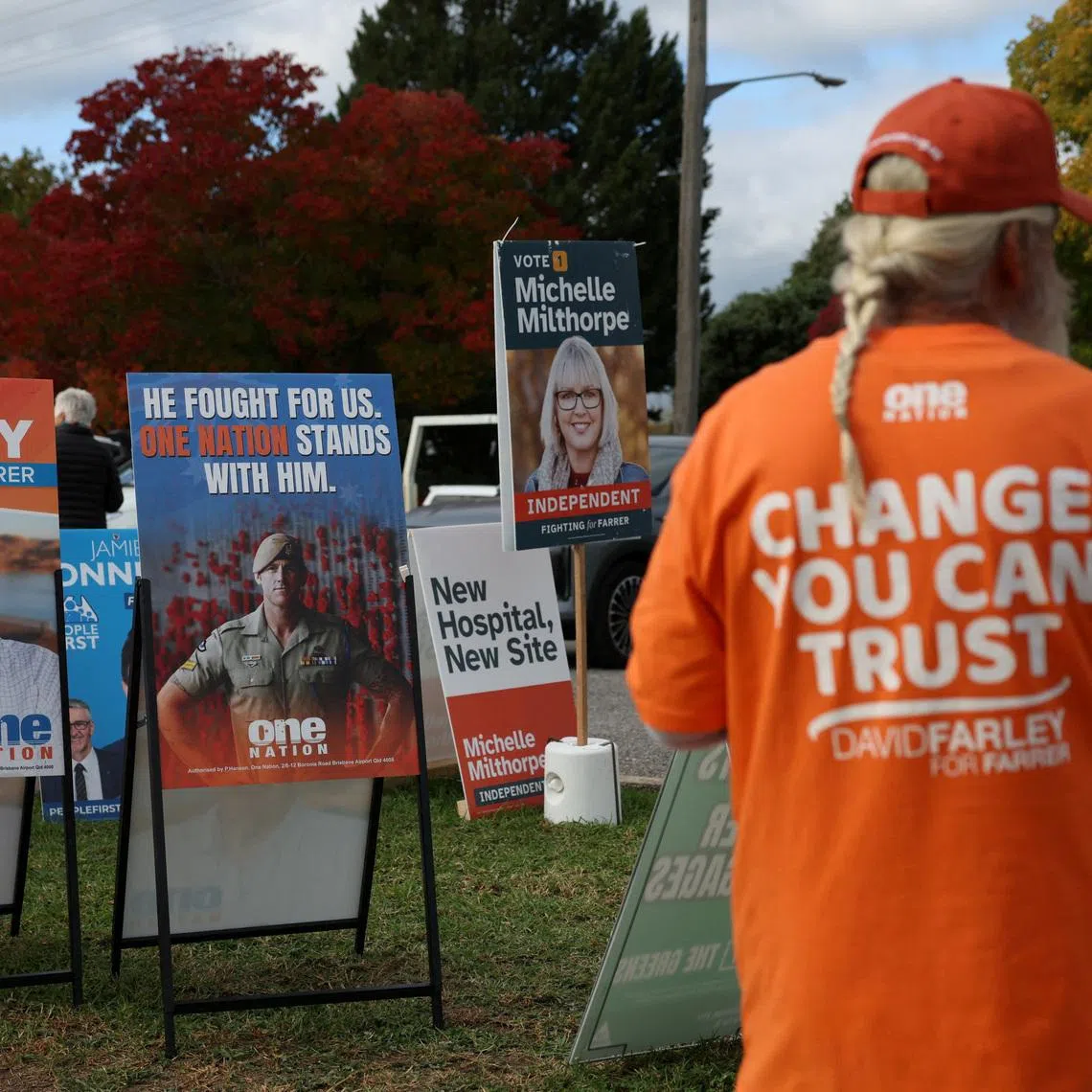FILE PHOTO: Campaign signs depicting One Nation candidate David Farley and former Australia soldier Ben Roberts-Smith are displayed outside a pre-polling centre ahead of the Farrer by-election in Albury, Australia, May 6, 2026. REUTERS/Hollie Adams/File Photo