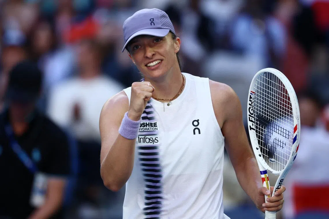 Tennis - Australian Open - Melbourne Park, Melbourne, Australia - January 22, 2026 Poland's Iga Swiatek celebrates after winning her second round match against Czech Republic's Marie Bouzkova REUTERS/Tingshu Wang
