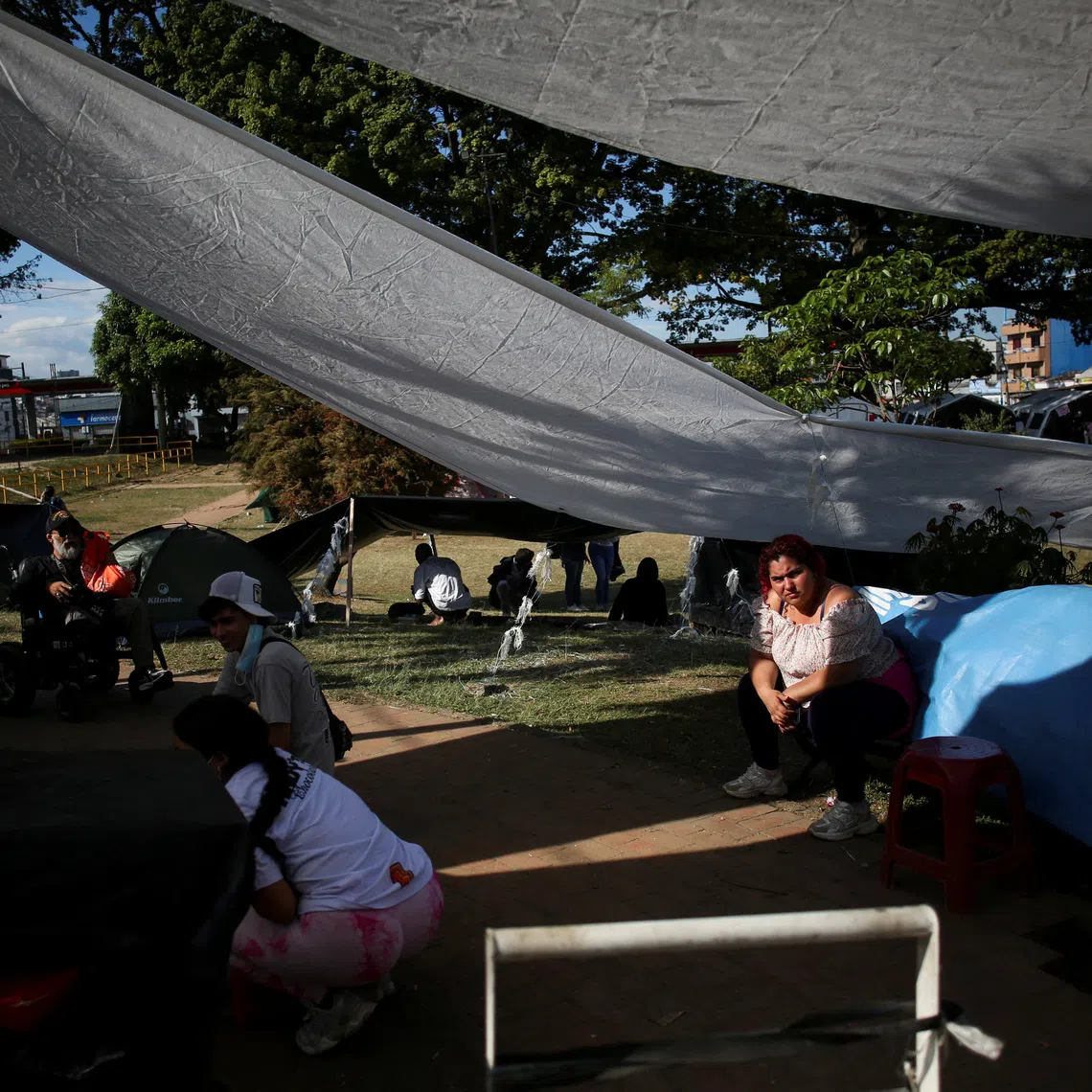 People affected by the earthquake rest at a temporary shelter camp in Olaya Herrera Park in Pereira, Colombia, August 13, 2026. REUTERS/Juan David Duque
