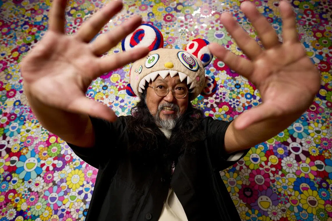 Tokyo-based artist Takashi Murakami in front of his Flowers series, ahead of his exhibition, Stepping On The Tail Of A Rainbow, at the Cleveland Museum of Art in April. 