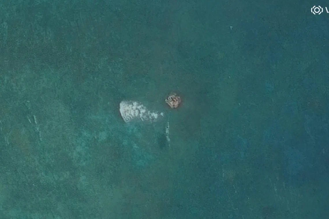 Philippines urges China to remove shoal structure, warns against island-building