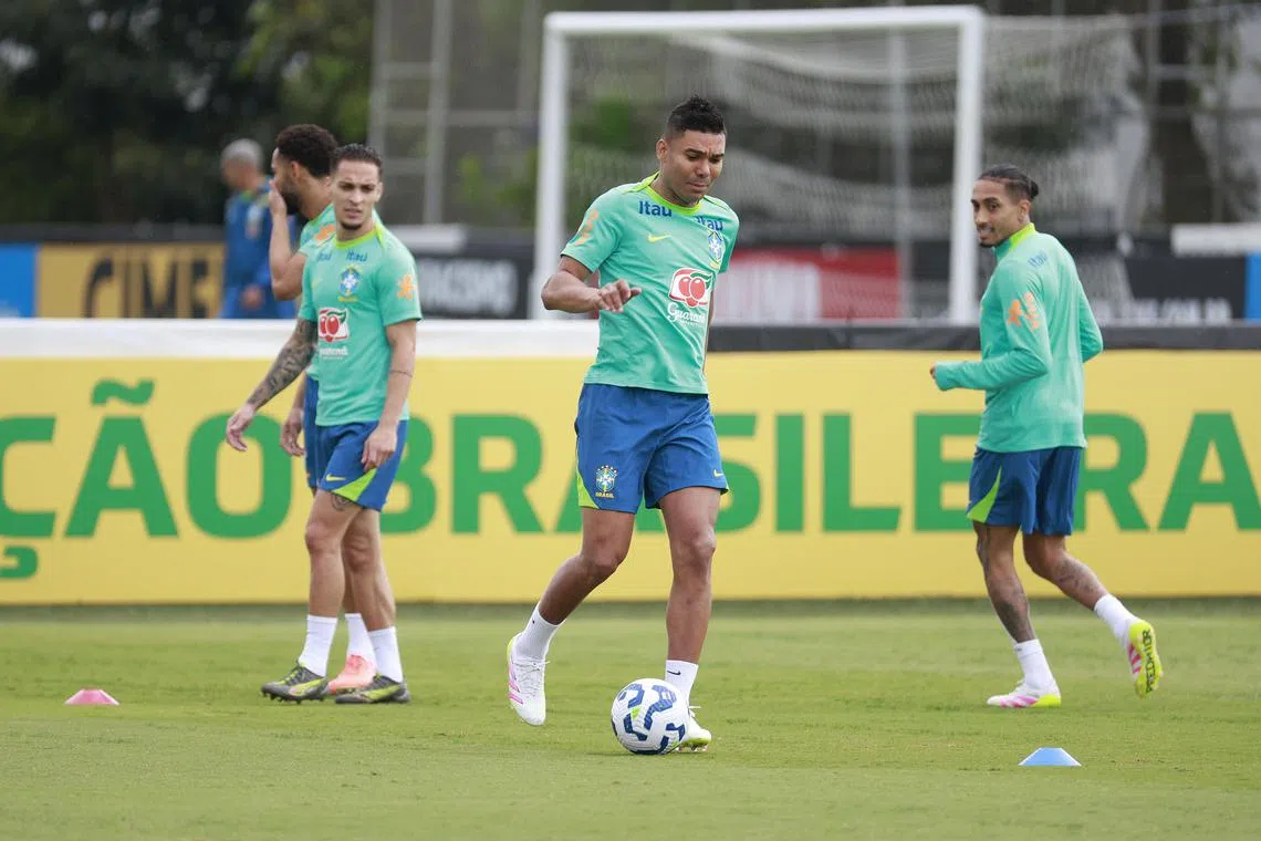 Casemiro (centre) said his Brazil call-up is on merit rather than due to his close relationship to national team coach Carlo Ancelotti.