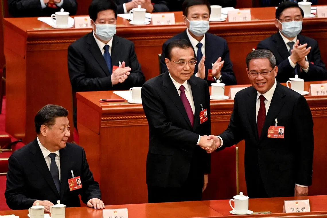 Mr Li Qiang (right), a trusted loyalist of President Xi Jinping (left), succeeds Premier Li Keqiang.