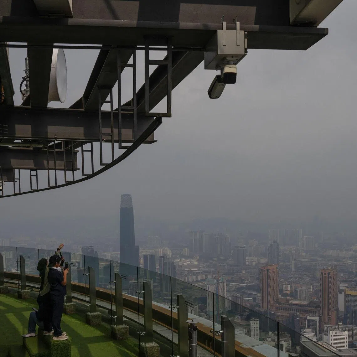 Kuala Lumpur’s skyline on Aug 11, covered in haze caused by wildfires burning through swathes of Borneo.