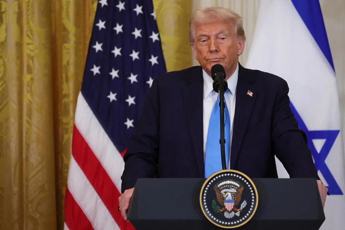 U.S. President Donald Trump looks on as he holds a joint press conference with Israeli Prime Minister Benjamin Netanyahu in the East Room at the White House in Washington, U.S., February 4, 2025. REUTERS/Leah Millis