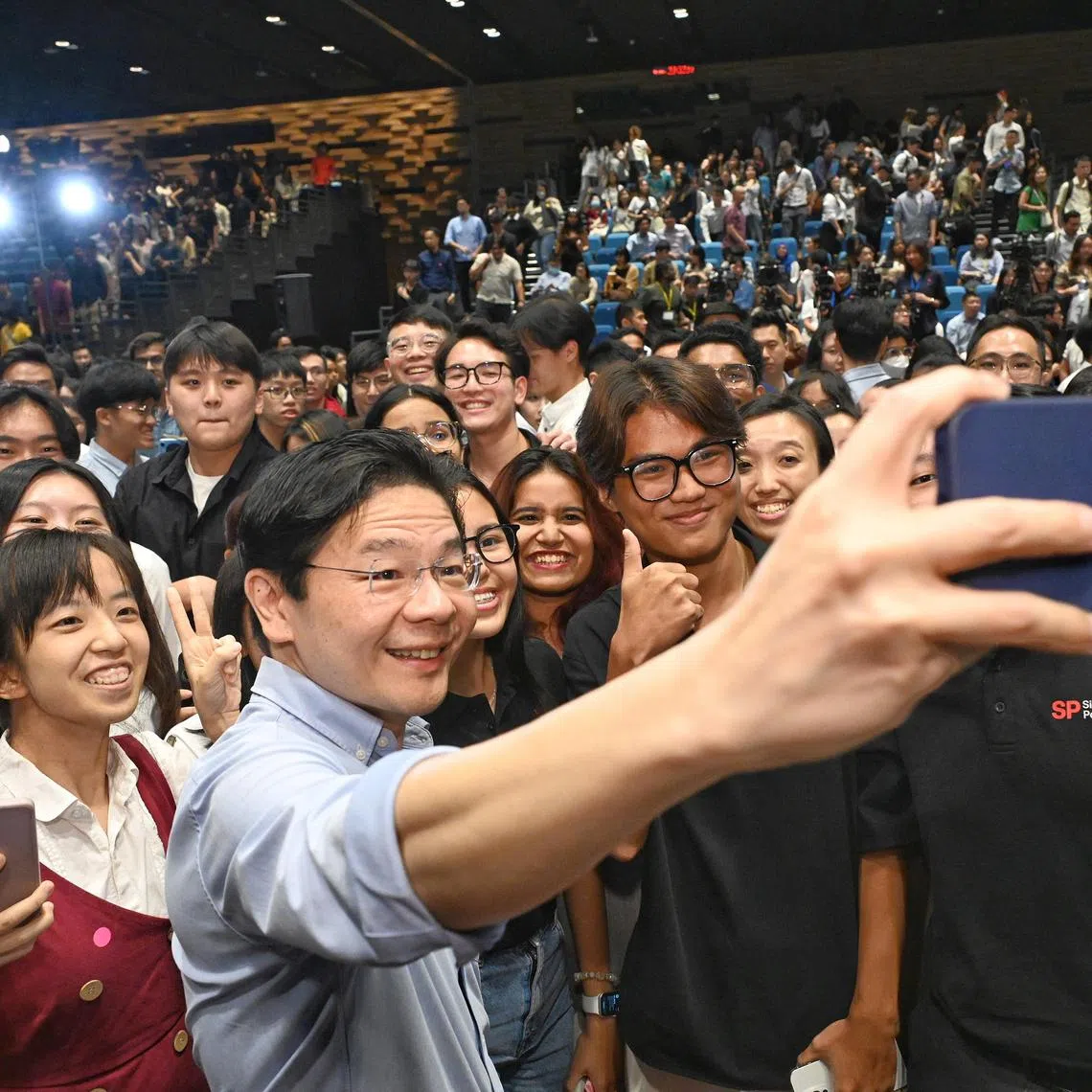 Prime Minister and Minister for Finance Mr Lawrence Wong taking wefie with students studying in Institutes of Higher Learning (IHLs) on July 2, 2024 . The event began with a speech delivered by PM Wong, focusing on domestic topics such as jobs and the economy, followed by a Question-and-Answer dialogue session, moderated by SMU President Professor Lily Kong. Pix taken at SMU.
(Pls note: The students are from different institutions; from universities, polytechnics and ITE. Not all of them are from SMU. Tks)