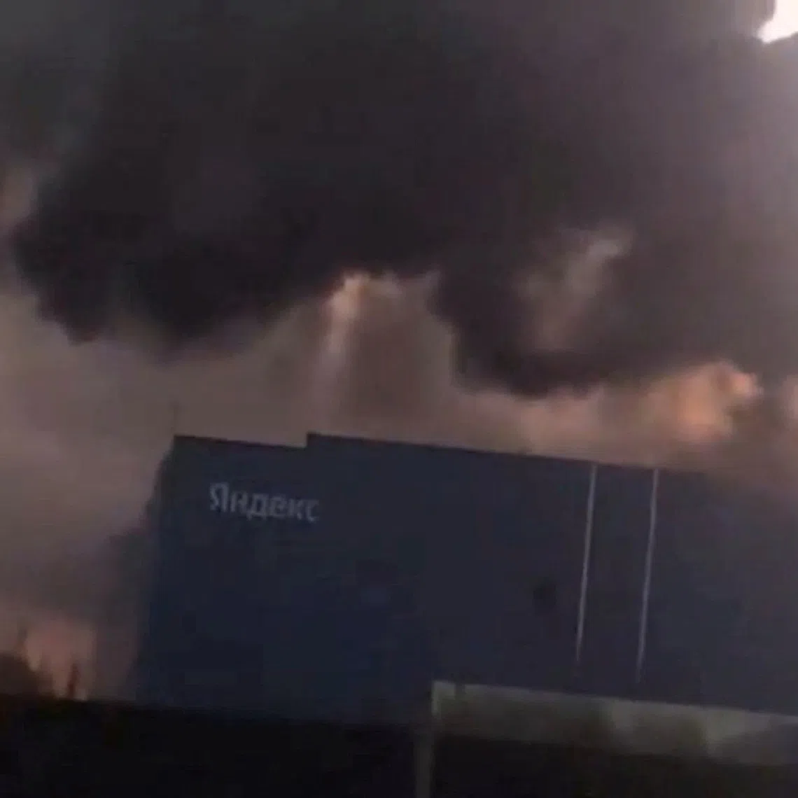 FILE PHOTO: Smoke billows from Yandex's Sasovo hub, one of the company's five large data centres, after a fire following a drone strike forced the suspension of operations at the site, which hosts tens of thousands of servers, Sasovo, Russia, in this screengrab obtained from a social media video on Otober 8, 2026. SOCIAL MEDIA/via REUTERS. THIS IMAGE HAS BEEN SUPPLIED BY A THIRD PARTY. MANDATORY CREDIT. NO RESALES. NO ARCHIVES.  Verification lines: Petrol station, data centre building and road layout matched satellite and archive imagery Coordinates: 54.3729250068205, 41.934405711751126 Date verified by statement from Yandex saying that drones hit one of its major data centers in Russia's Ryazan region on October 8 NASA FIRMS detected thermal activity at the location on October 8, where there is not typically./File Photo